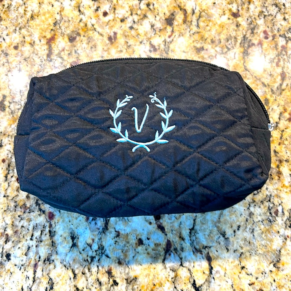 Cosmetic case with a “V” embroidered on front.  New.